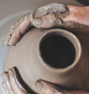 Hands forming a pot